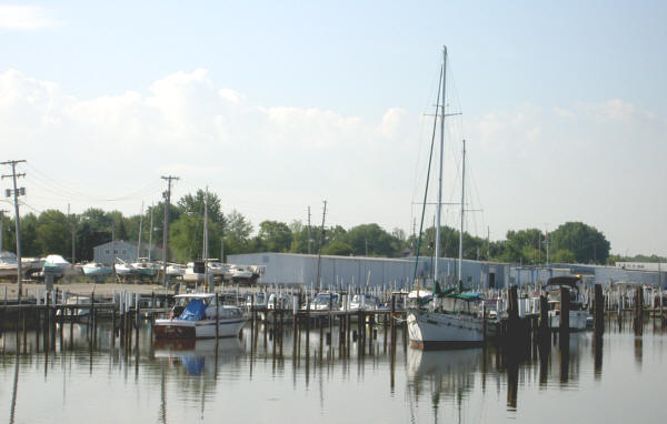 Boats ride low next to high marina docks in Bay City, showing effects of low water levels.