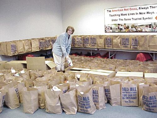 Project coordinator Erin Dunkla<br>checks Project Angel bags