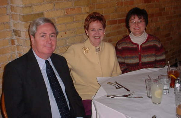 Sen. James Barcia, Sen. Nancy Cassis and Sen. Michelle McManus confer after Senate Finance Committee hearing in Bay City.