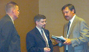 City Manager Robert V. Belleman, center, and assistant Steve Black, left,  meet with developers after his presentation to the Bay Area On The Go development expo in the new DoubleTree Hotel/Conference Center.