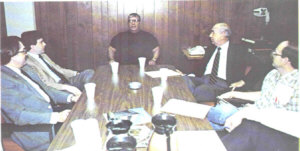 Discussions at Bay City's General Motors plant in the mid-1980s involved, from left, Ted Binnall, UAW International representative, State Rep. Tom Hickner, UAW President Ed Huizar, Dick Konicek of Forward Bay County, and Mike Rozek, UAW bargaining team.