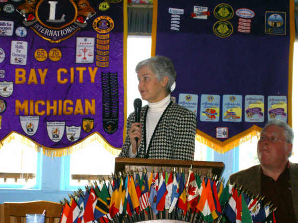 Linda Heemstra and Dennis Poirier (right), Lions Club president, react to a tough question about the Bay County Library System at last Wednesday's Lions meeting.