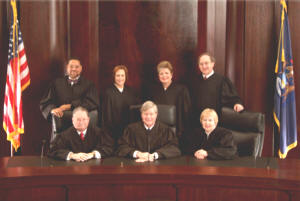 Michigan Supreme Court Justice Maura Corrigan, top row, second from right, and fellow justices, bottom left, Michael F. Cavanagh, Chief Justice Clifford Taylor and Elizabeth A. Weaver, top row right, Robert Young, Marilyn Kelly, Corrigan, Stephen Markman.