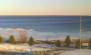 Great Lakes Environmental Research Laboratory webcam photo at Thunder Bay, Alpena, shows exposed rocks from low water.