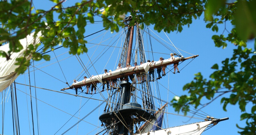 High Work As Young Sailors Furl Sails