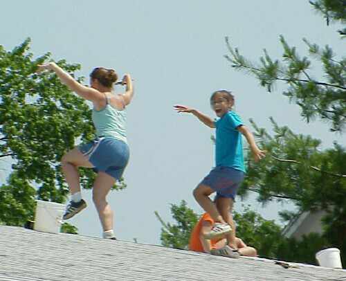 Roof dancers celebrate a job well done