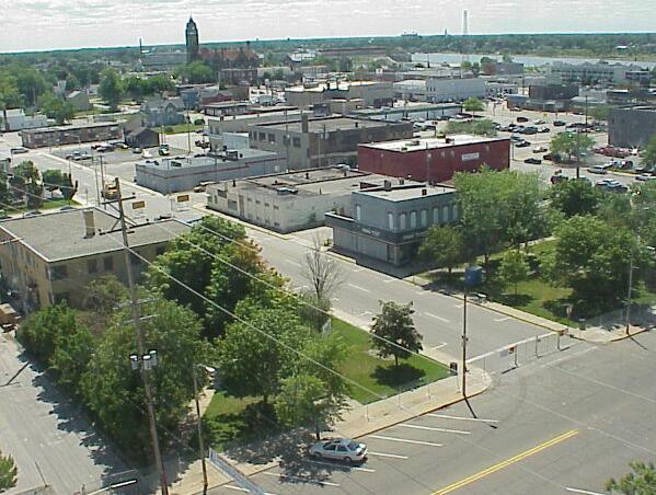 Site of new Central Library looking southwest from County building<br>Old jail near left, Fish's on right.