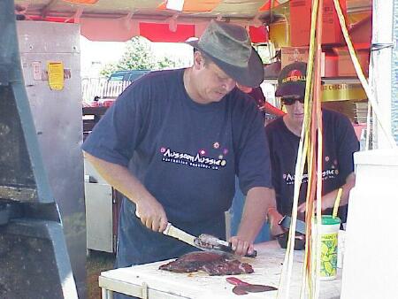 Chuck Hern prepares ribs for the Aussom Aussie