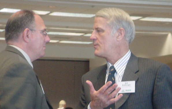 State Sen. Mike Goschka, left, and political pundit Bill Ballenger, jawbone at the Tri County Economic Club at Saginaw Valley State University recently.