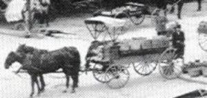 Fruit peddler's wagon is loaded and ready to leave the old Bay County Market on Washington in the 1890s.