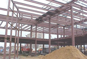 Steel framework for a new Central Library on Center at Jefferson rises against the sky, (above), and will be shaped into a stately 63,000 sq. ft. facility in less than a year.