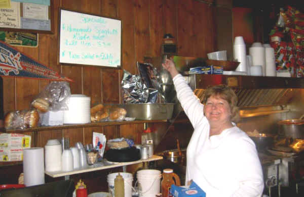 Renie Wyzgowski proudly points to a trophy she won for her Midland Street Pub chili last fall at the Mayor's Chili Cookoff on Midland Street.