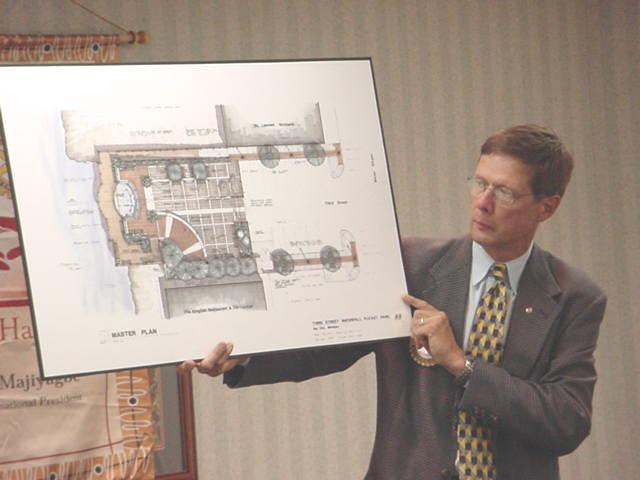 Rob Monroe, CEO of Gougeon Brothers, Inc., and board member of Wenonah Park Properties, shows graphic of Waterfall Park at the foot of Third Street , funded under Michigan's 