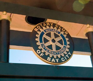 Rotary seal above historic kiosk in first Rotary Micro-Park